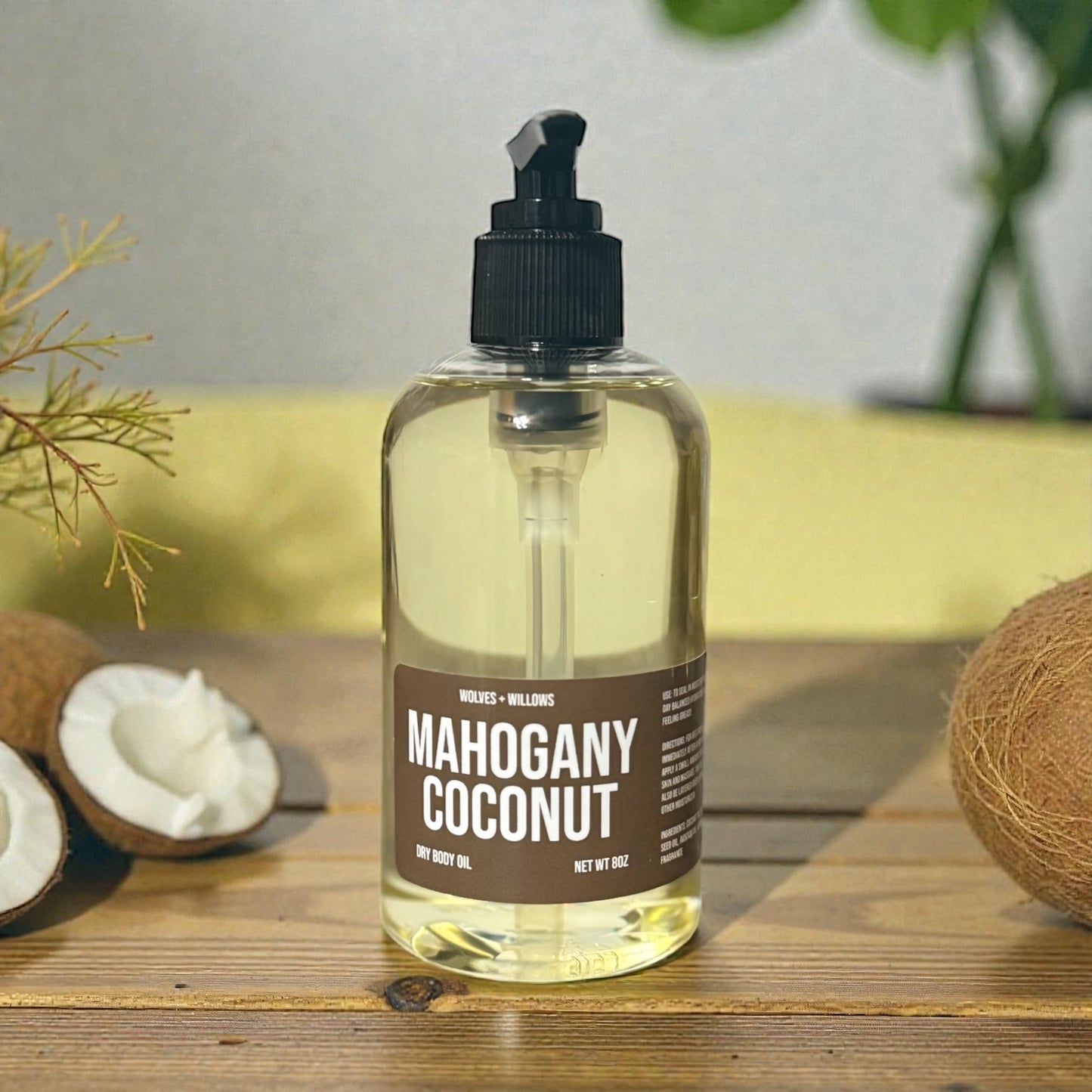 Mahogany Coconut 8 ounce body oil in clear bottle with black pump.