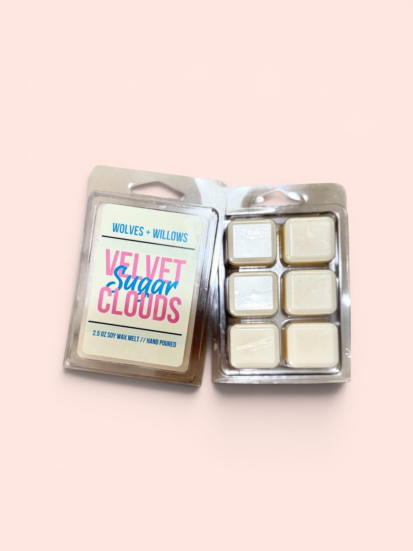 Wax melts in a packaging with 'Wolves & Willows' branding on a light pink background
