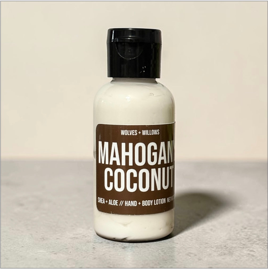 Lotion bottle labeled 'Mahogan Coconut' by Wolves & Willows on a neutral background