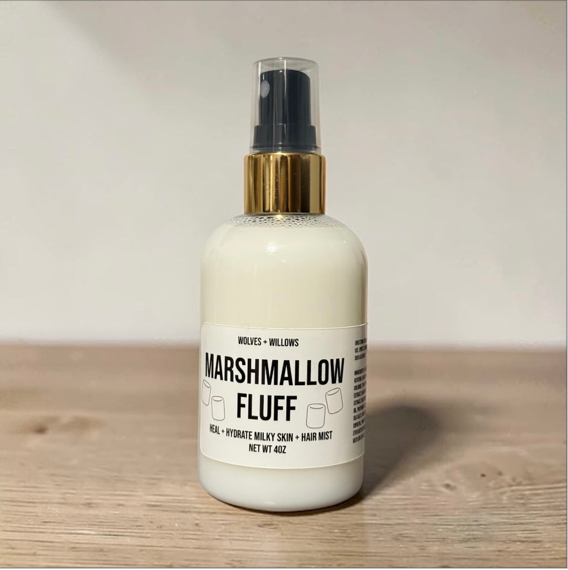 Bottle of Marshmallow Fluff product on a wooden surface with a neutral background