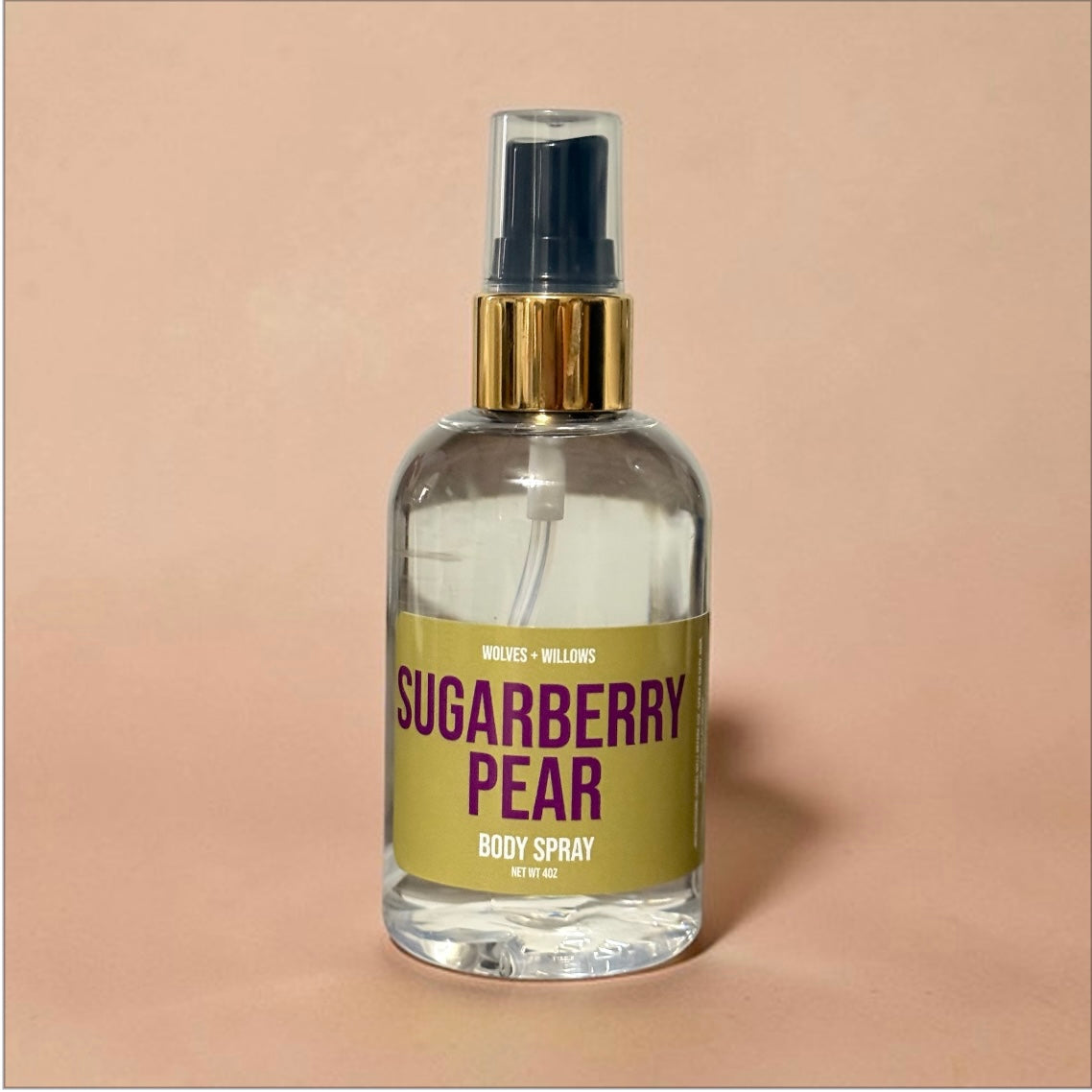 Body spray bottle labeled 'Sugarberry Pear' on a beige background