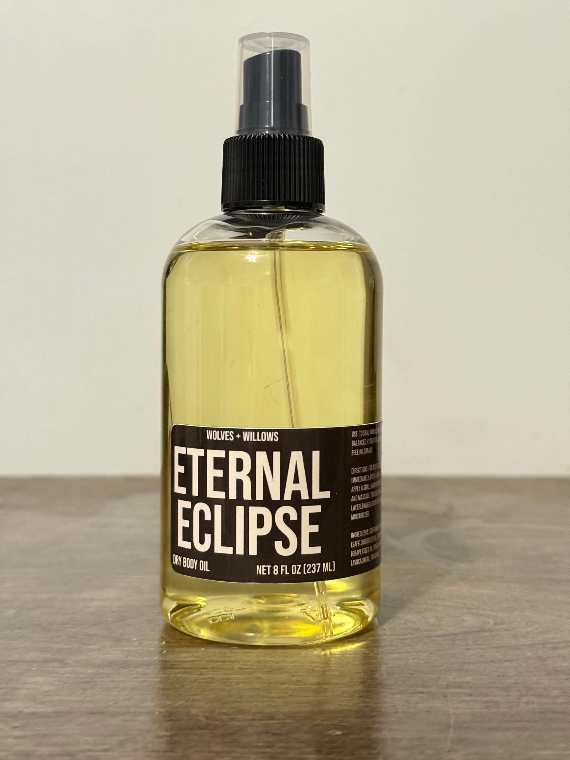 Bottle of 'Eternal Eclipse' with a black label on a light background