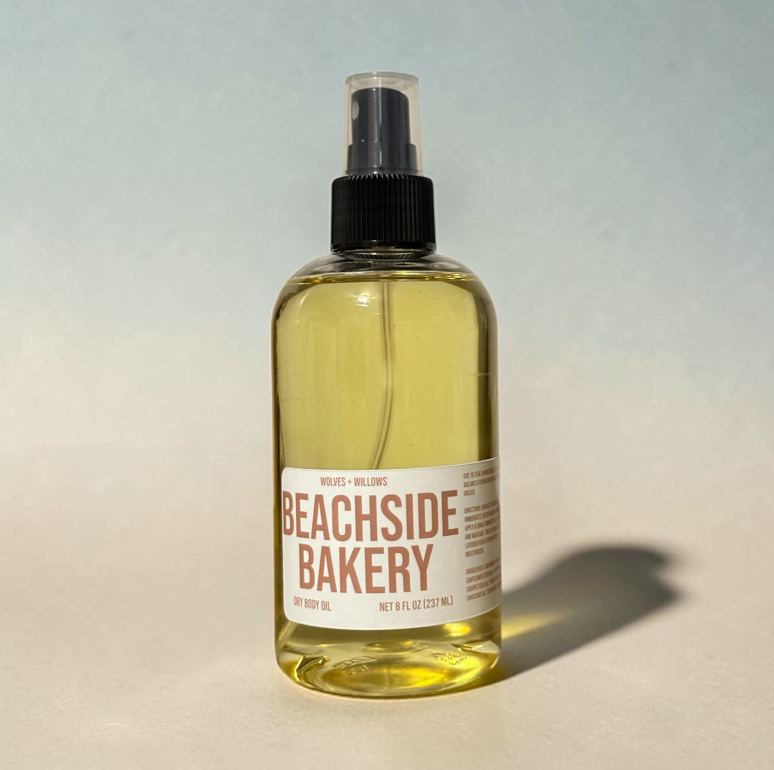 Bottle of Beachside Bakery product on a gradient background
