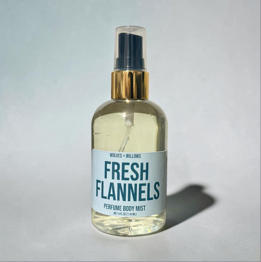 Perfume body mist bottle labeled 'Fresh Flannels' on a light gray background