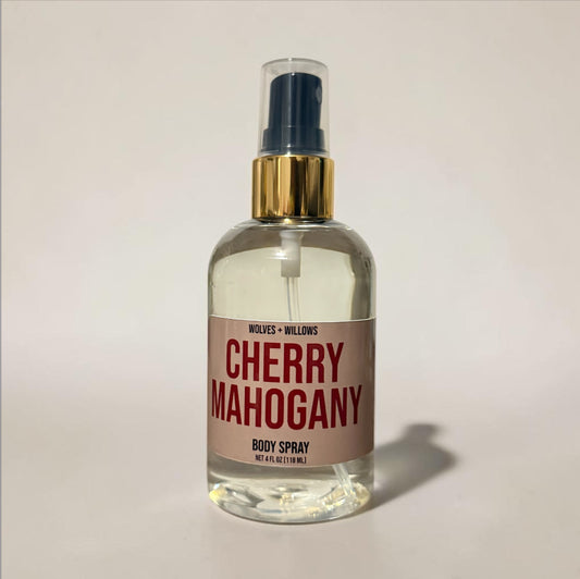 Body spray bottle labeled 'Cherry Mahogany' by Wolves & Willows on a light background