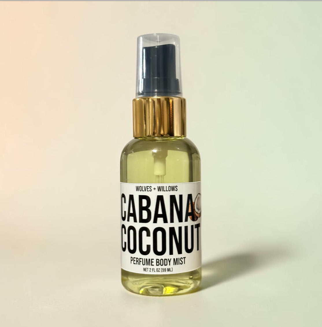 Perfume body mist bottle labeled 'Cabana Coconut' on a beige background
