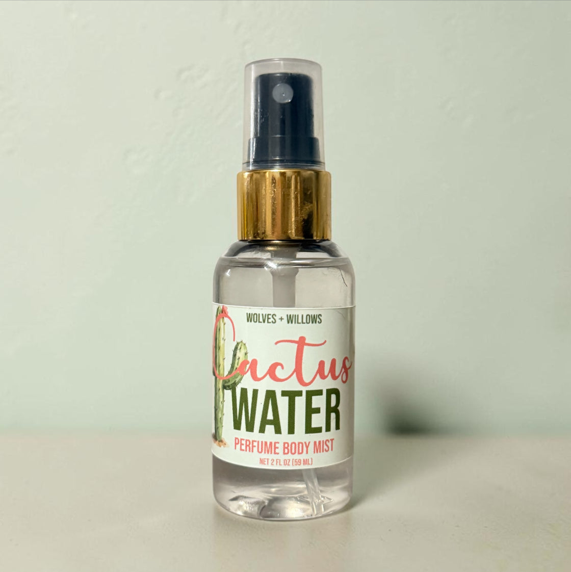 Clear spray bottle labeled 'Dactus Water' on a light background