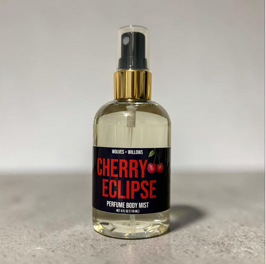 Perfume body mist bottle labeled 'Cherry Eclipse' by Wolves & Willows on a neutral background