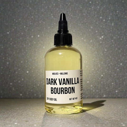 dark vanilla bourbon body oil in 4 ounce bottle with black twist dispensing cap.