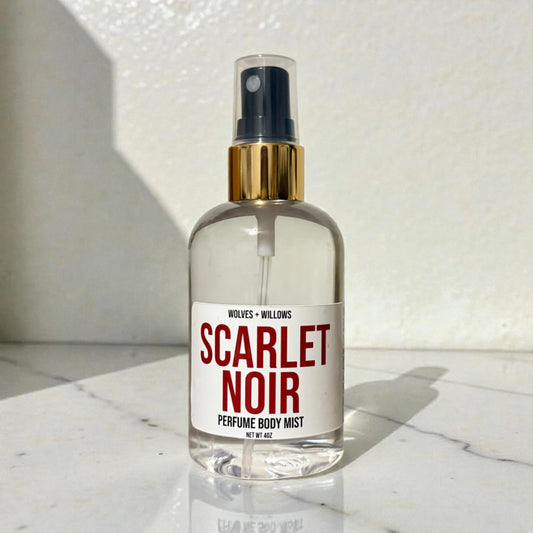 Scarlet Noir perfume body mist bottle on a marble surface