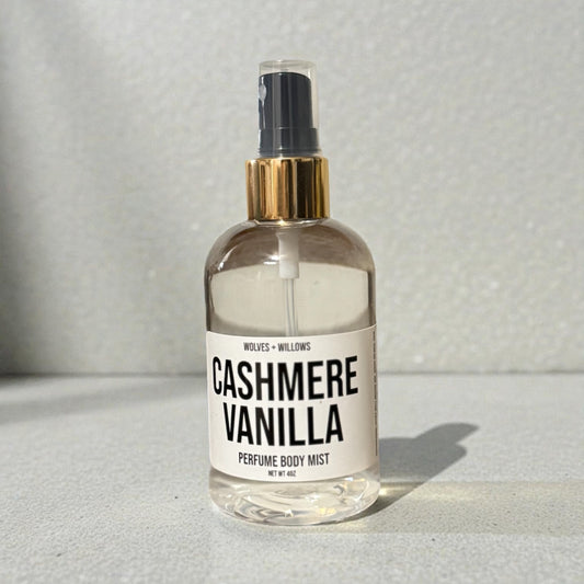 Bottle of 'Cashmere Vanilla' perfume body mist on a neutral background