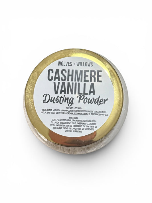 Cashmere Vanilla dusting powder container with gold lid on a white background