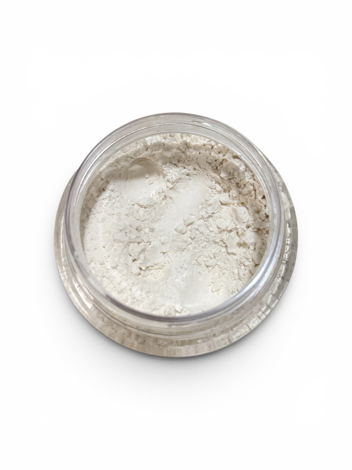 Jar of white powder on a white background