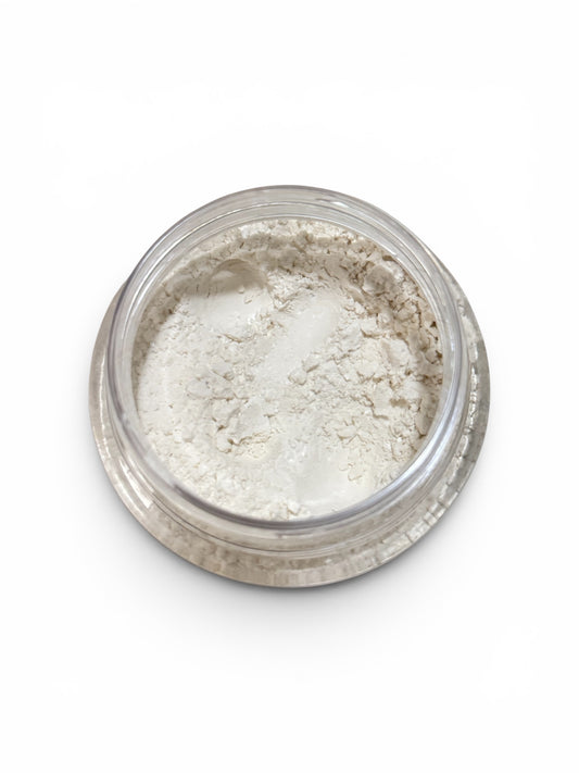 Jar of white powder on a white background