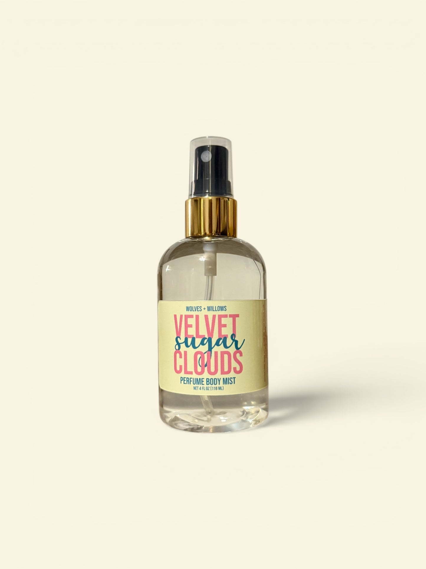 Perfume bottle labeled 'Velvet Sugar Clouds' on a beige background