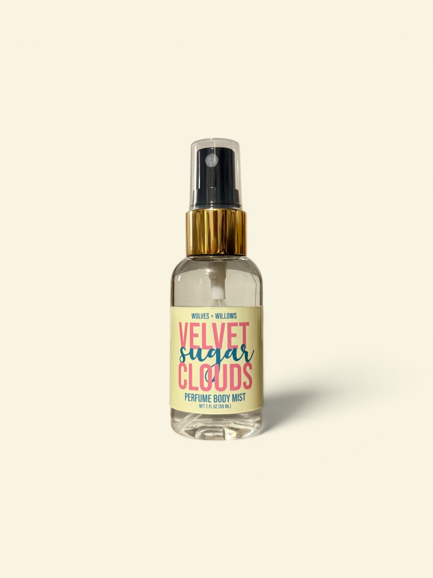 Perfume body mist bottle labeled 'Velvet Sugar Clouds' on a beige background