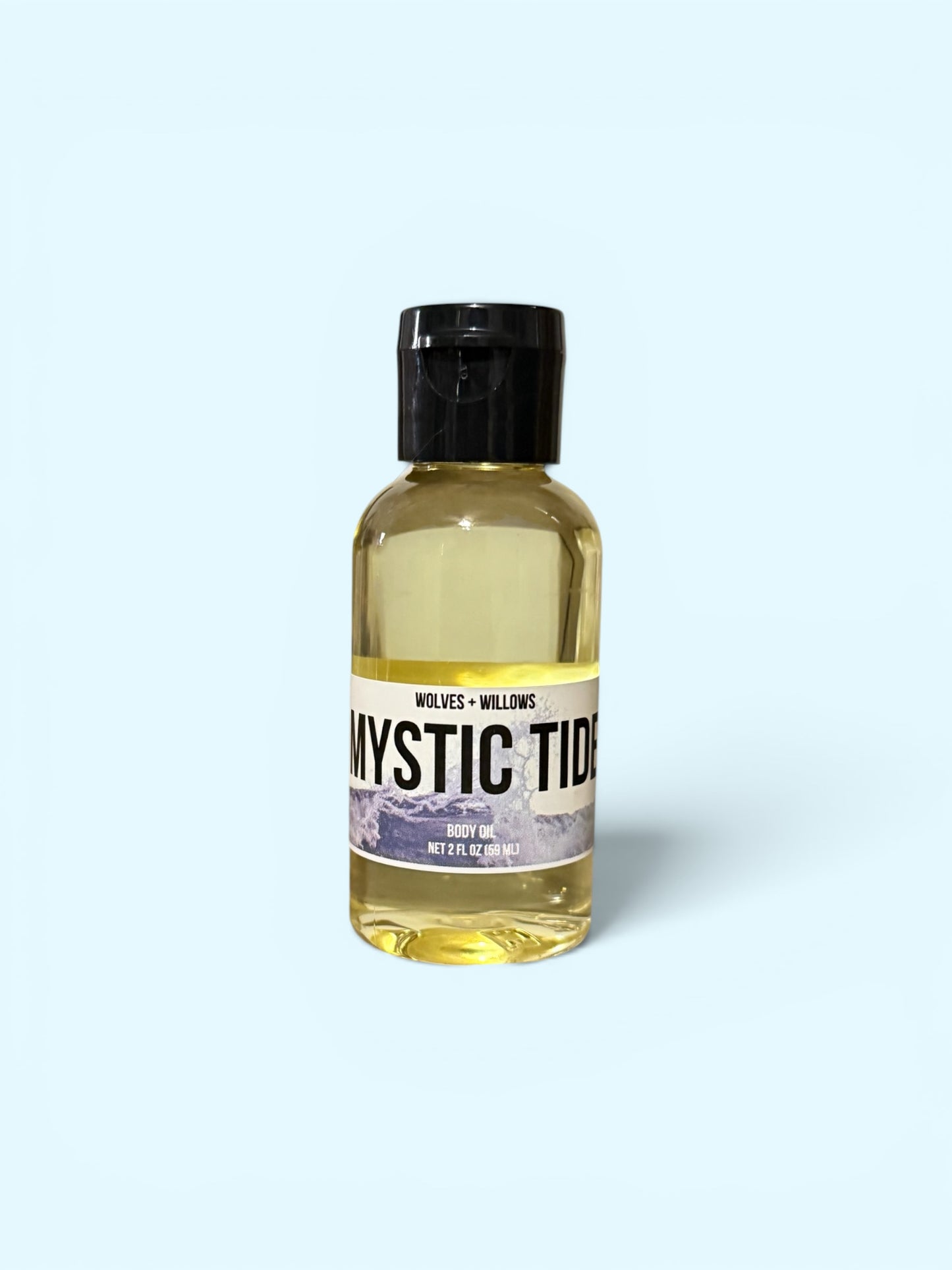 Bottle of 'Mystic Tide' body oil with a black cap on a white background