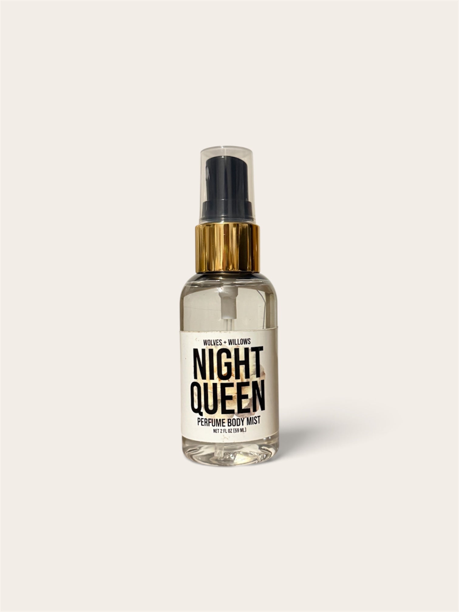 A clear glass spray bottle of 'Night Queen' perfume body mist by Wiles + Willing, featuring a gold collar and a black spray nozzle, set against a solid off-white background.