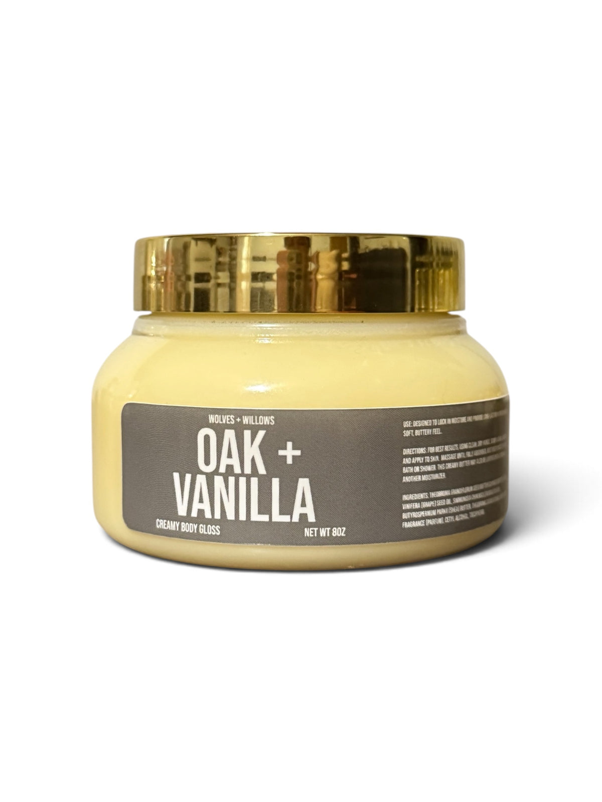 oak and vanilla body butter in clear jar, with white label, and gold cap.